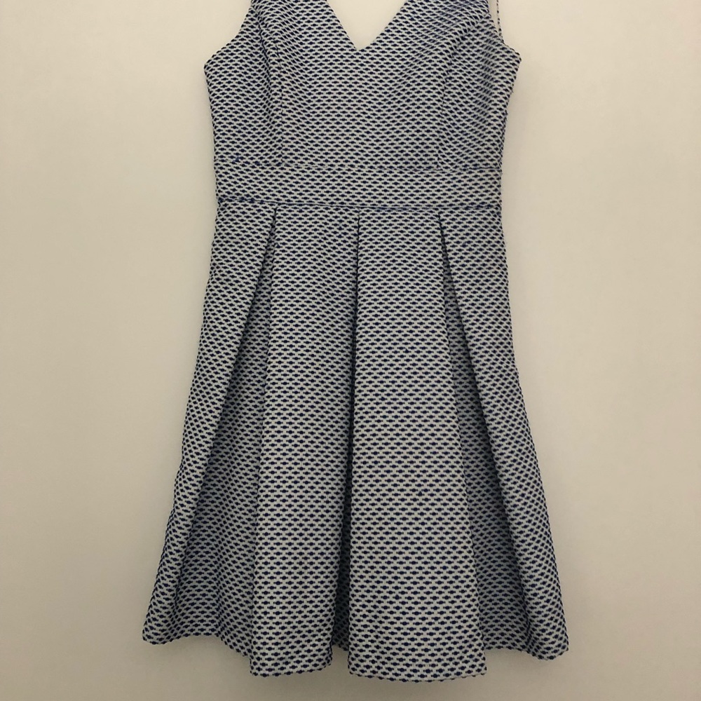 Blue and white dress with bow and open back